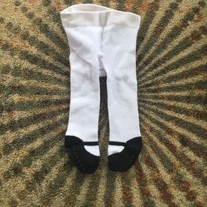White tights with black ballerina shoe accent